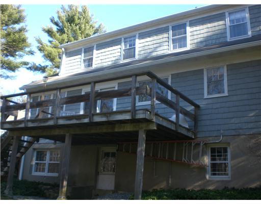 137 Cutler Road Greenwich, CT 06831 - Photo 2 of 20 a building with black door