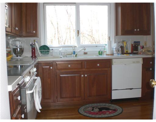 137 Cutler Road Greenwich, CT 06831 - Photo 7 of 20 a kitchen with a sink a window and cabinets