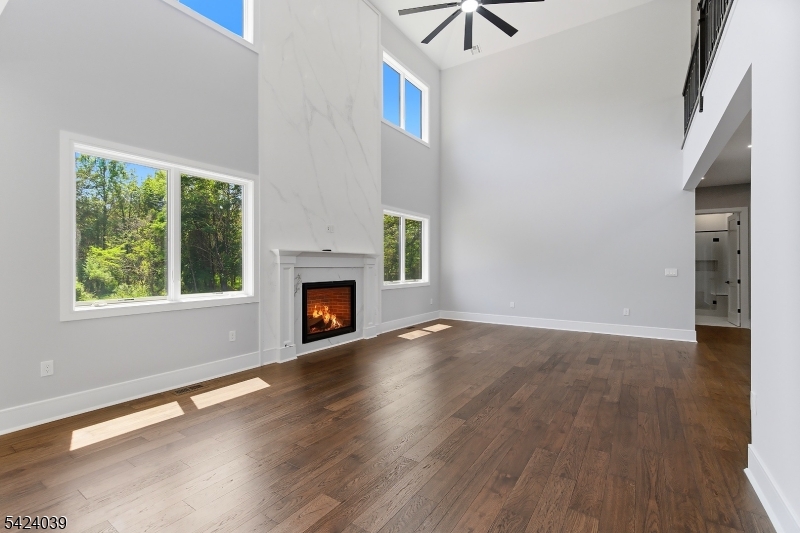 45 Kildee Road Belle Mead, NJ 08502 - Photo 33 of 43 a view of empty room with wooden floor and fireplace