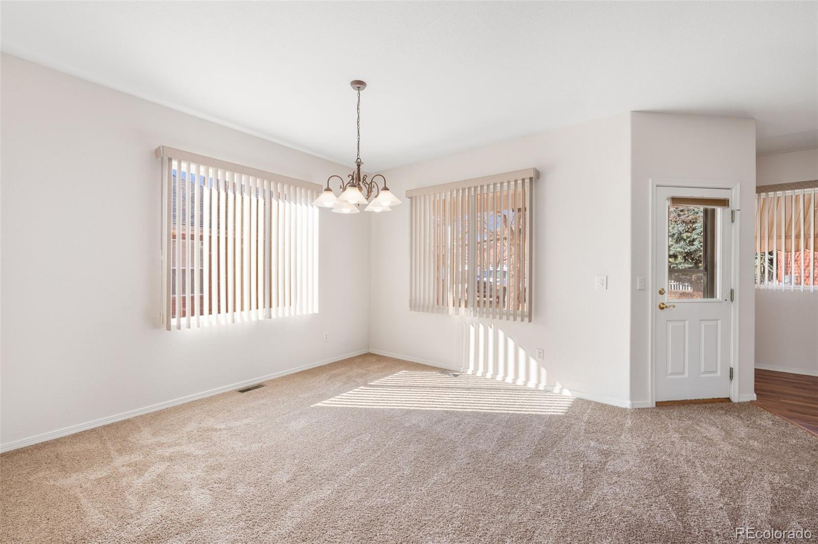 203 Hubbell Street Berthoud, CO 80513 - Photo 13 of 49 a view of an empty room with a window