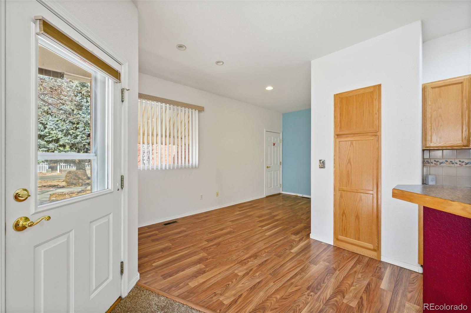 203 Hubbell Street Berthoud, CO 80513 - Photo 16 of 49 a view of a room with wooden floor and a window