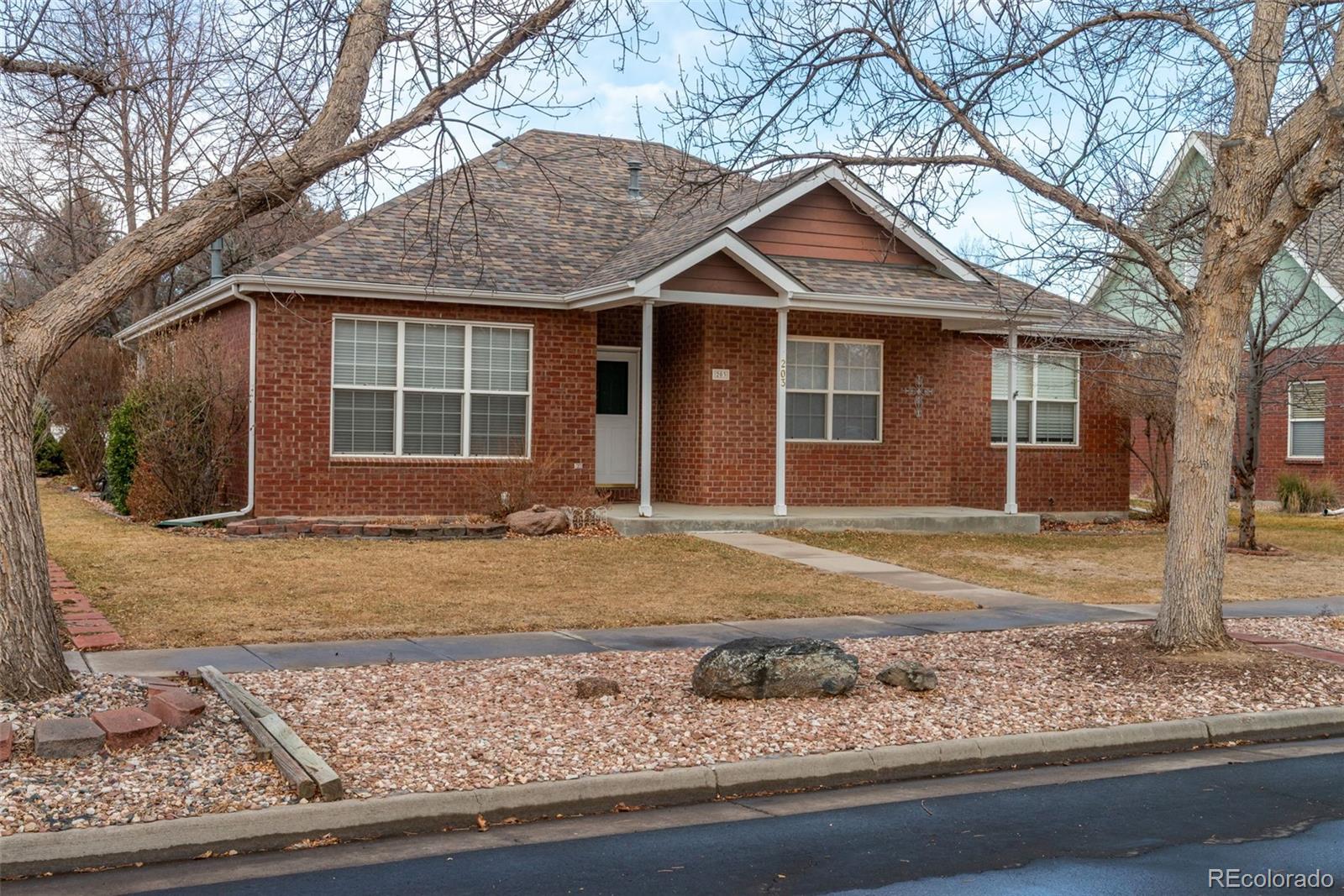 203 Hubbell Street Berthoud, CO 80513 - Photo 2 of 49 a front view of a house with garden