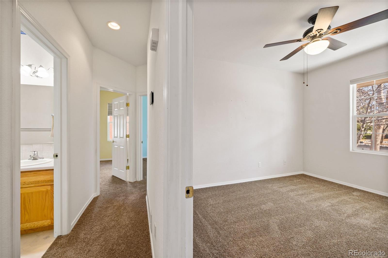 203 Hubbell Street Berthoud, CO 80513 - Photo 22 of 49 wooden floor in an empty room with a window