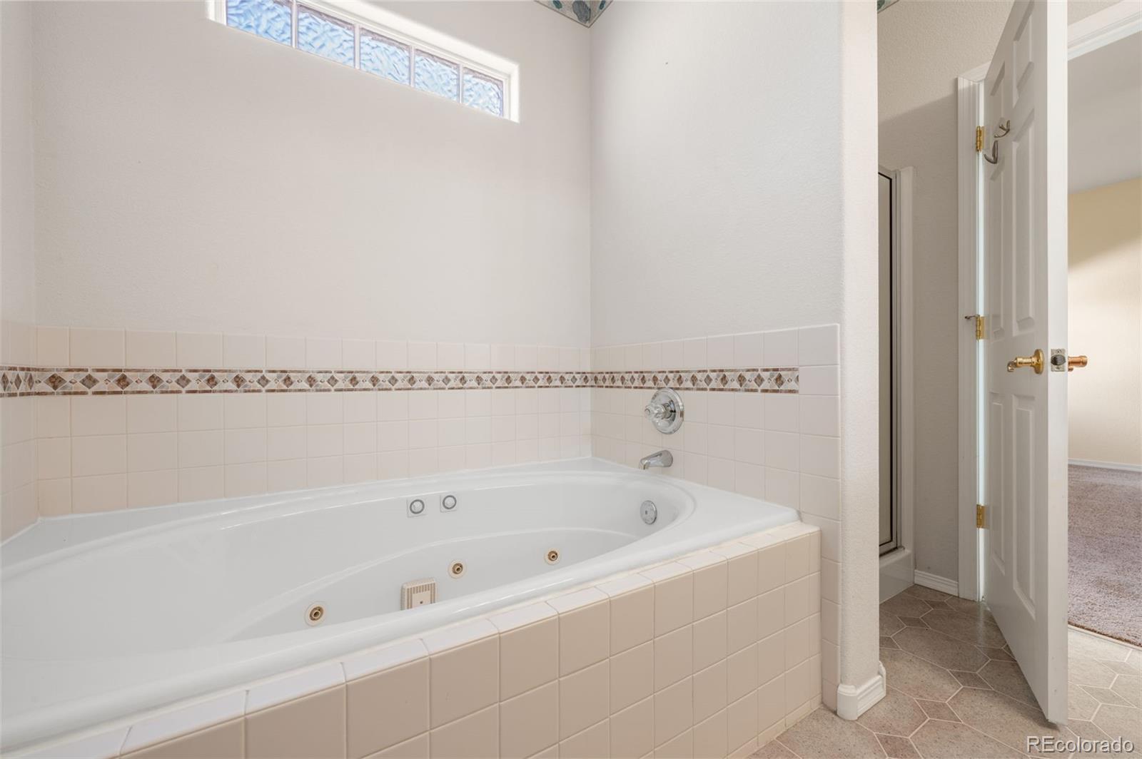 203 Hubbell Street Berthoud, CO 80513 - Photo 26 of 49 a close view of a bathtub in bathroom
