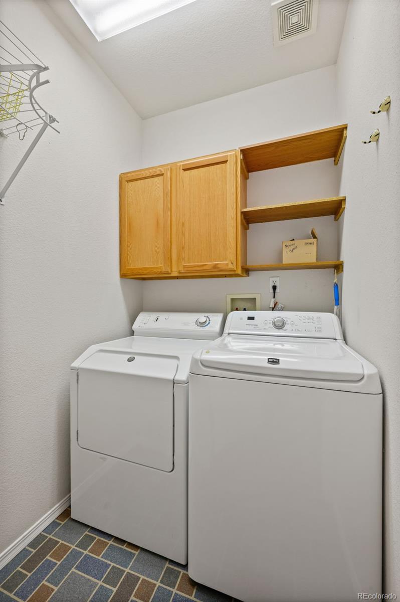 203 Hubbell Street Berthoud, CO 80513 - Photo 31 of 49 a utility room with dryer and washer
