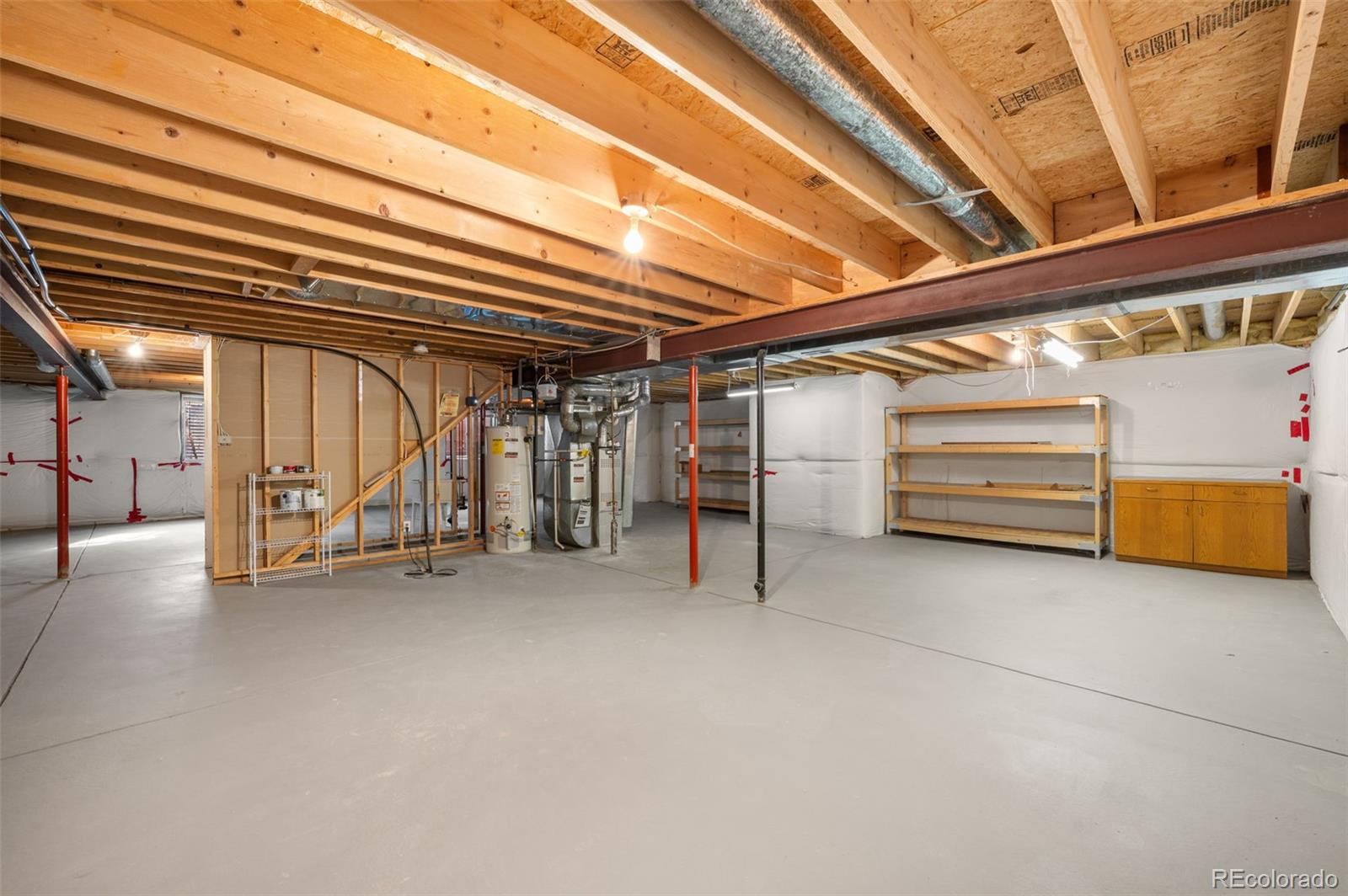 203 Hubbell Street Berthoud, CO 80513 - Photo 33 of 49 a view of an empty room with a staircase