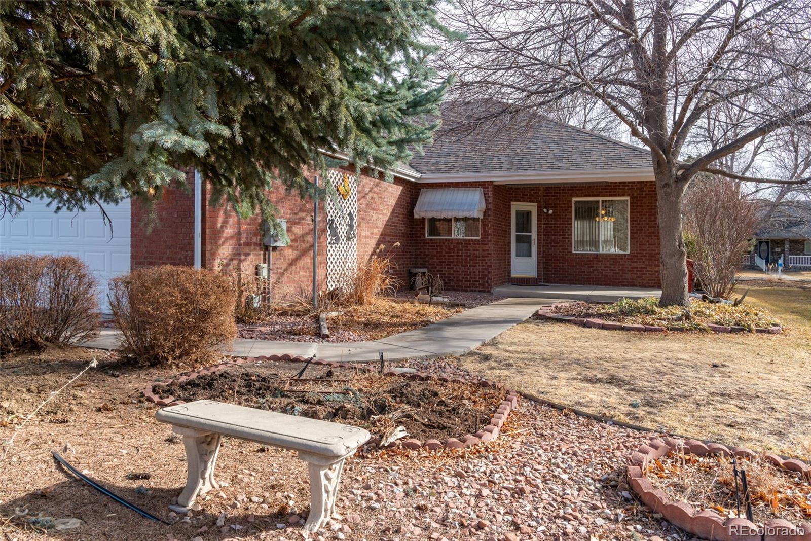203 Hubbell Street Berthoud, CO 80513 - Photo 35 of 49 a view of a house with a yard covered in snow