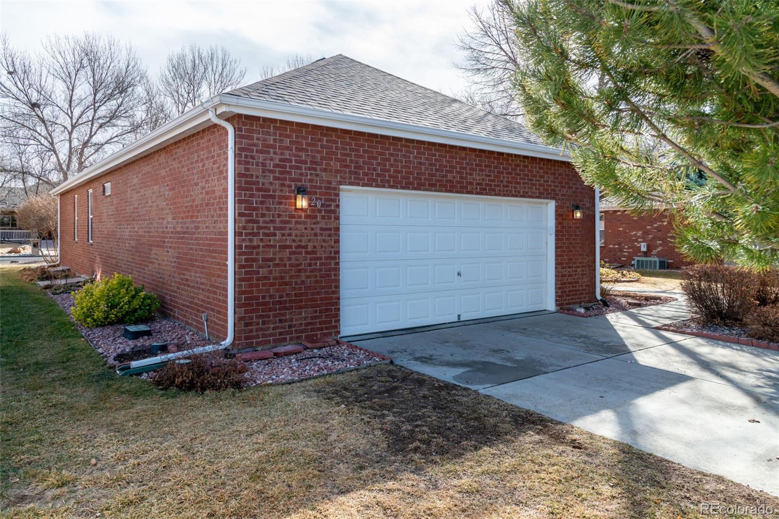 203 Hubbell Street Berthoud, CO 80513 - Photo 41 of 49 a front view of a house with garden