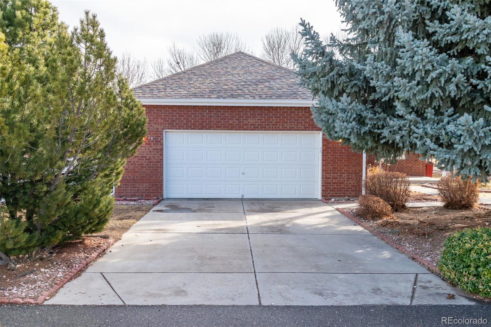 203 Hubbell Street Berthoud, CO 80513 - Photo 42 of 49 a house with trees in front of it