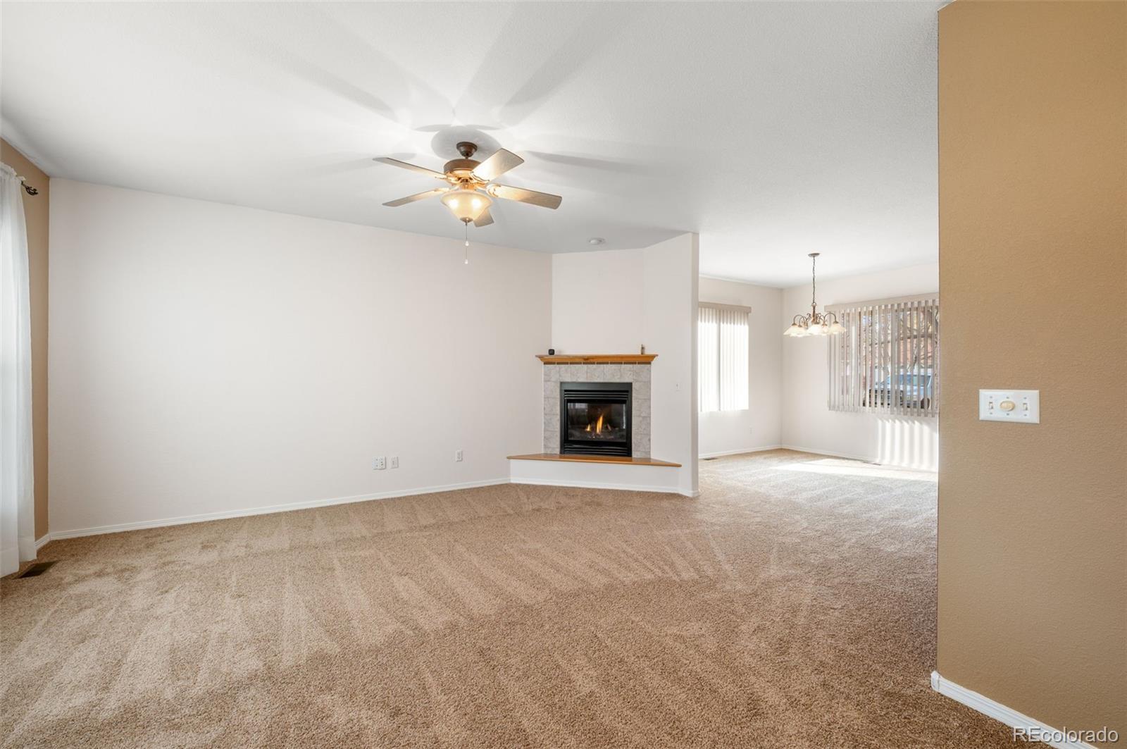 203 Hubbell Street Berthoud, CO 80513 - Photo 7 of 49 a view of an empty room with a fireplace