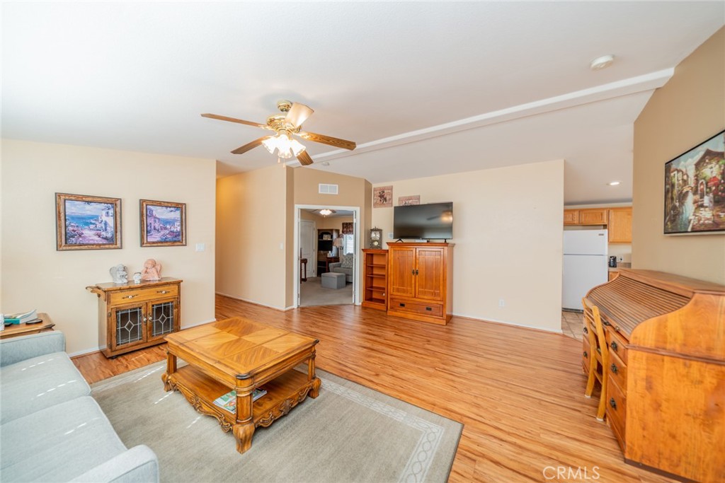 22241 Nisqually Road, Unit 118 Apple Valley, CA 92308 - Photo 11 of 56 a living room with furniture and kitchen view