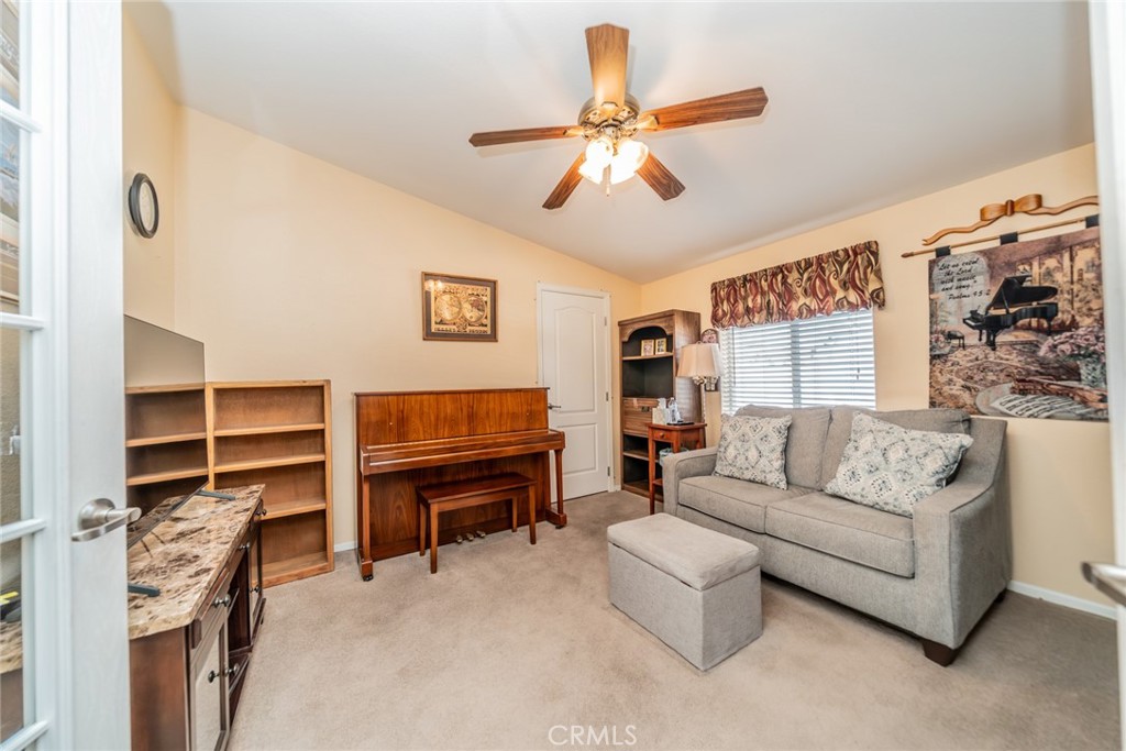 22241 Nisqually Road, Unit 118 Apple Valley, CA 92308 - Photo 12 of 56 a living room with furniture and a window