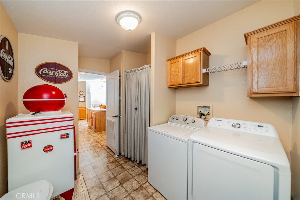 22241 Nisqually Road, Unit 118 Apple Valley, CA 92308 - Photo 19 of 56 a utility room with dryer and washer