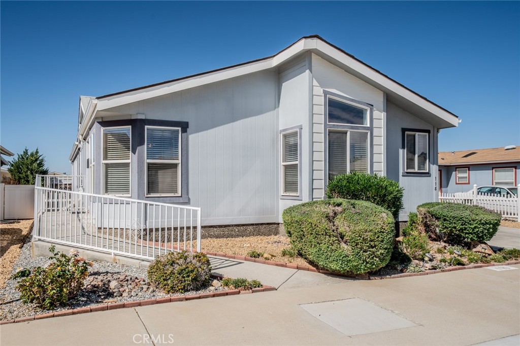 22241 Nisqually Road, Unit 118 Apple Valley, CA 92308 - Photo 4 of 56 a front view of a house with garden