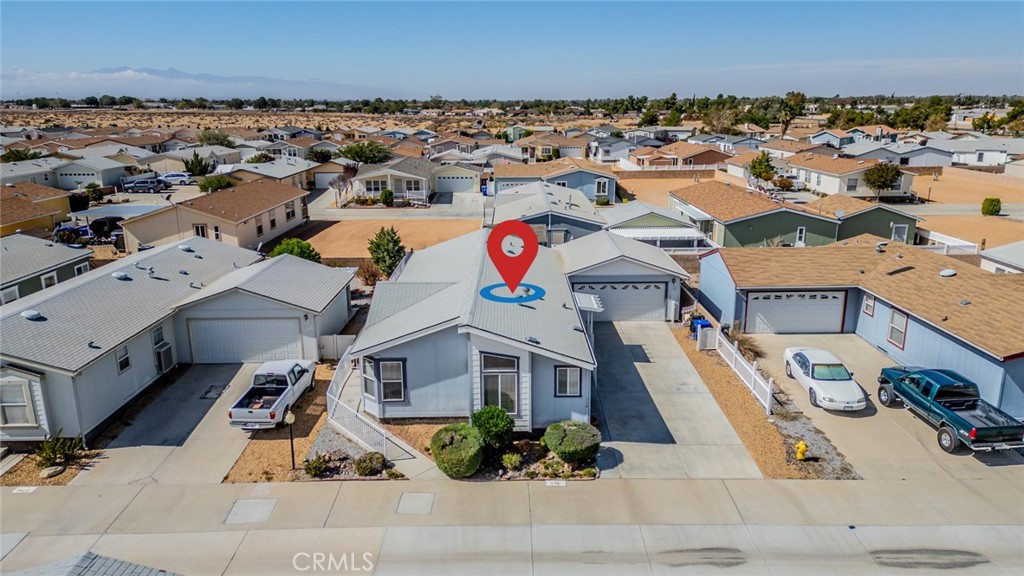 22241 Nisqually Road, Unit 118 Apple Valley, CA 92308 - Photo 41 of 56 an aerial view of a house with a garden