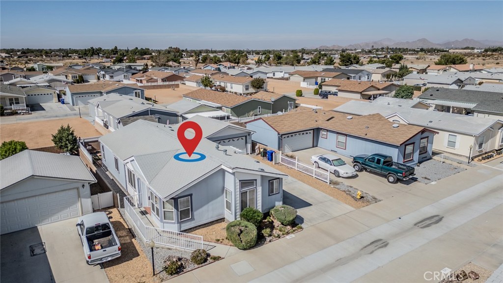 22241 Nisqually Road, Unit 118 Apple Valley, CA 92308 - Photo 42 of 56 an aerial view of residential houses with outdoor space