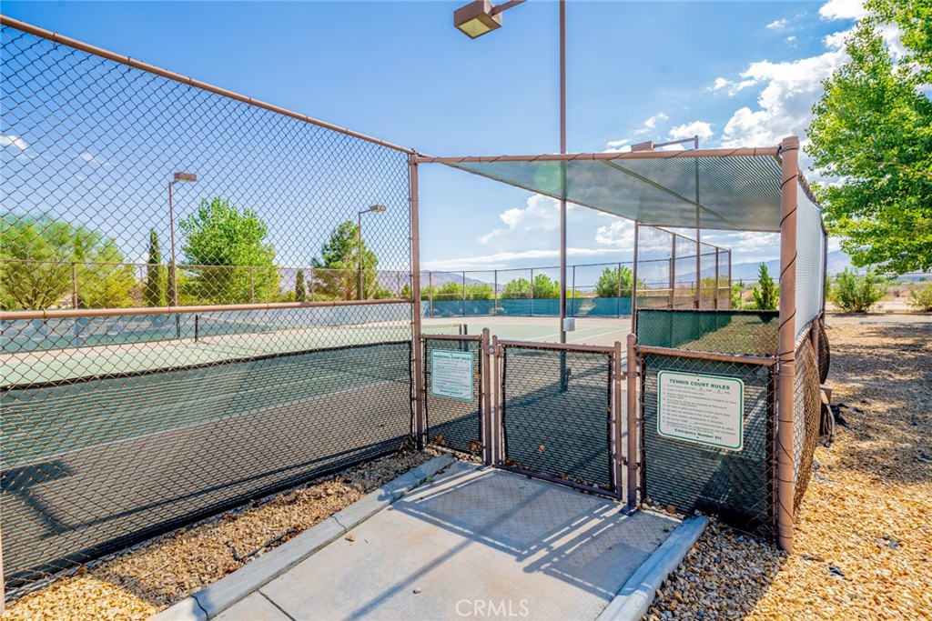 22241 Nisqually Road, Unit 118 Apple Valley, CA 92308 - Photo 46 of 56 a view of a couple of people in a patio