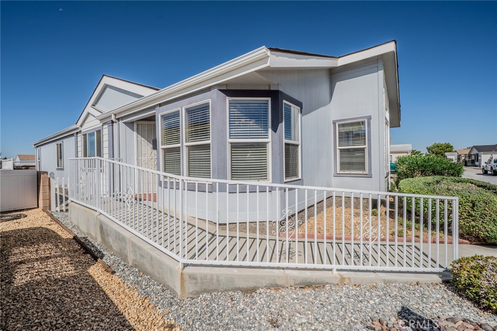 22241 Nisqually Road, Unit 118 Apple Valley, CA 92308 - Photo 5 of 56 a view of a house with wooden fence