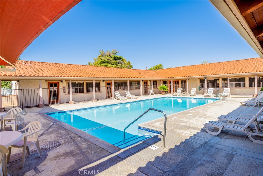 22241 Nisqually Road, Unit 118 Apple Valley, CA 92308 - Photo 53 of 56 swimming pool with outdoor seating