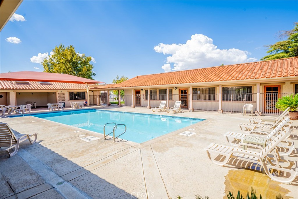 22241 Nisqually Road, Unit 118 Apple Valley, CA 92308 - Photo 54 of 56 a view of a house with swimming pool and sitting area