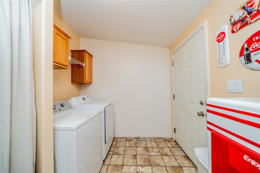22241 Nisqually Road, Unit 118 Apple Valley, CA 92308 - Photo 10 of 56 a bathroom with a sink and a shower curtain