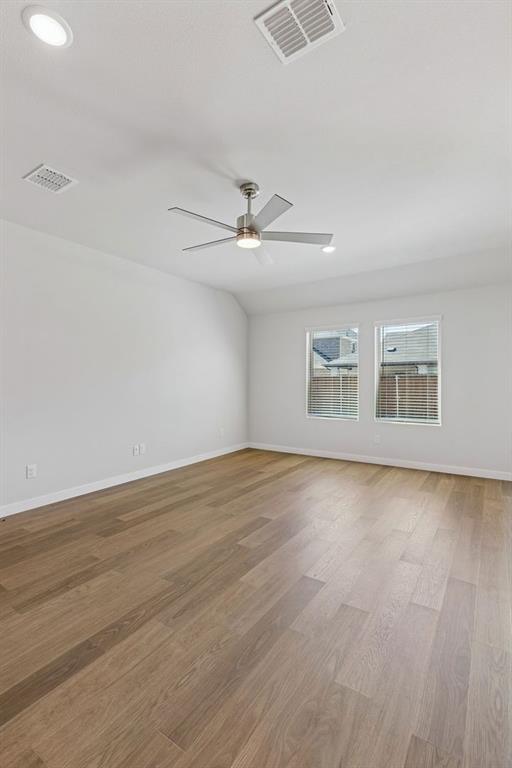1152 Del Rio Drive Lavon, TX 75166 - Photo 11 of 33 wooden floor in an empty room with a window