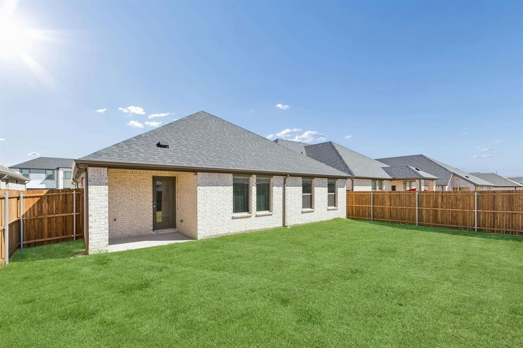 1152 Del Rio Drive Lavon, TX 75166 - Photo 29 of 33 a view of a house with a yard and a garden