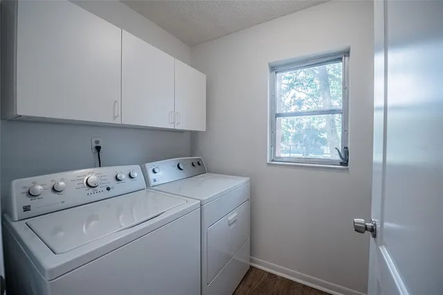 a view of storage and utility room with washer and dryer