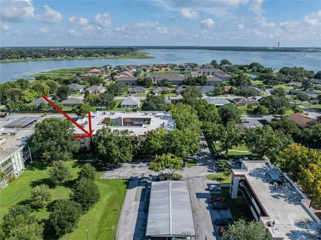 an aerial view of multiple house with a yard