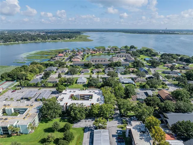 an aerial view of a city with lake view