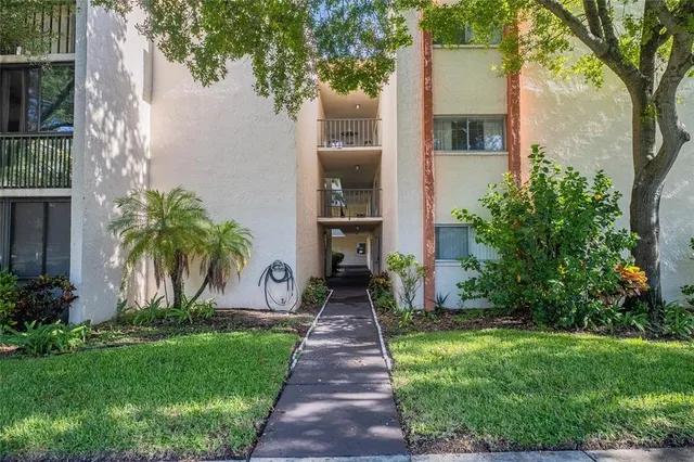 front view of a house with a yard and table and chairs