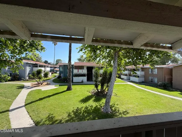 a swimming pool with outdoor seating and yard