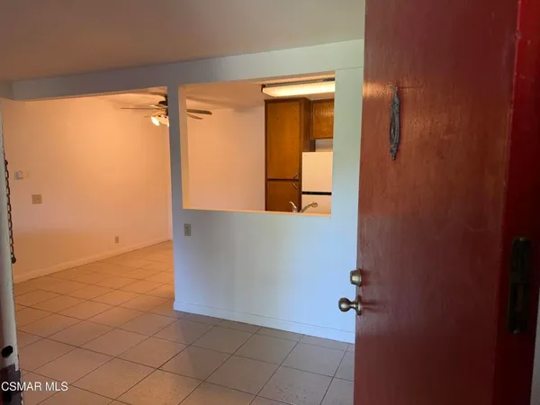 an empty room with mirror