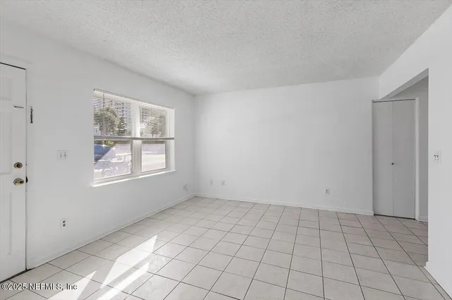 a view of an empty room and window