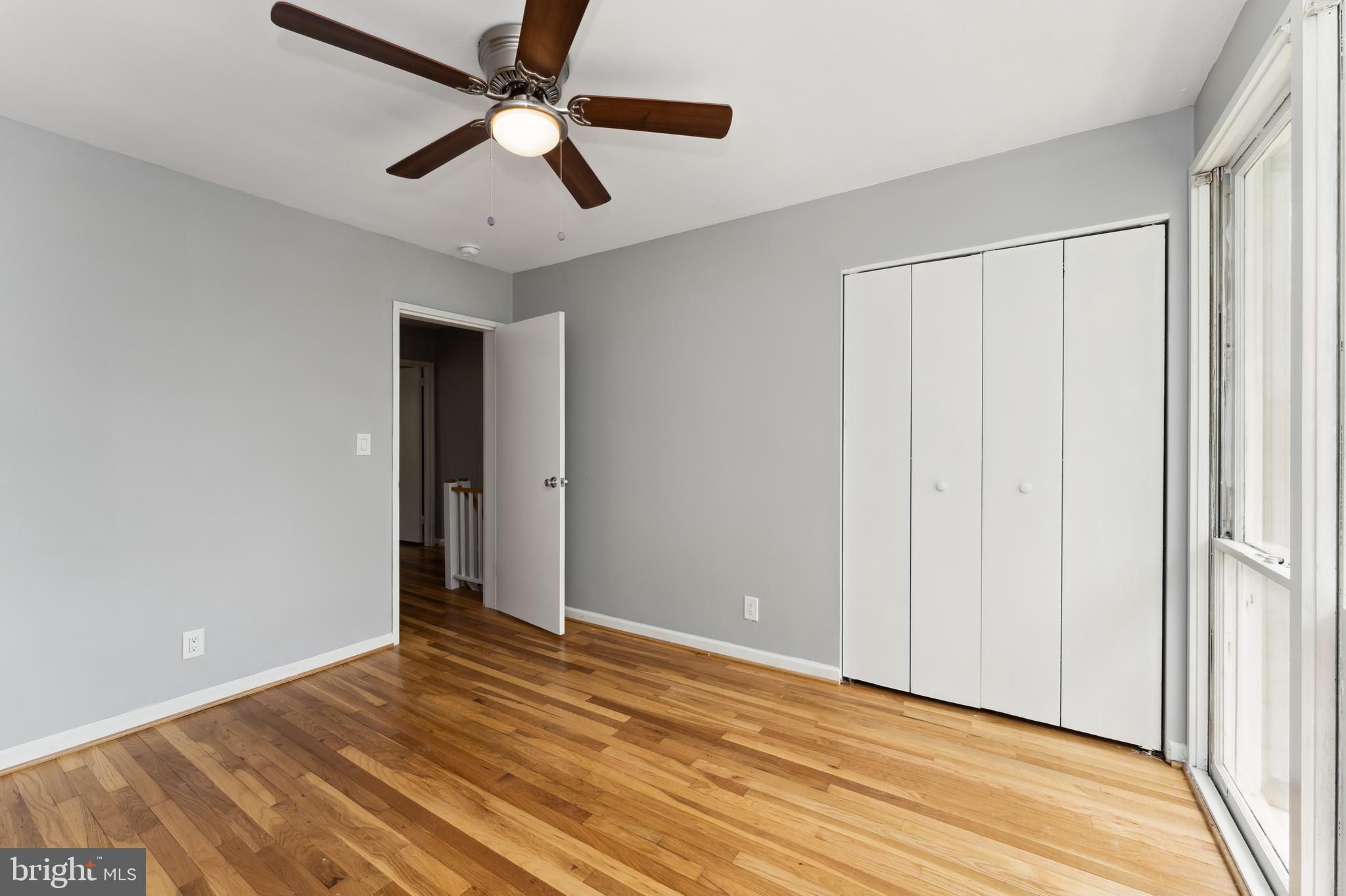 212 G Street Southwest, Unit 212 Washington, DC 20024 - Photo 11 of 17 a view of an empty room with wooden floor