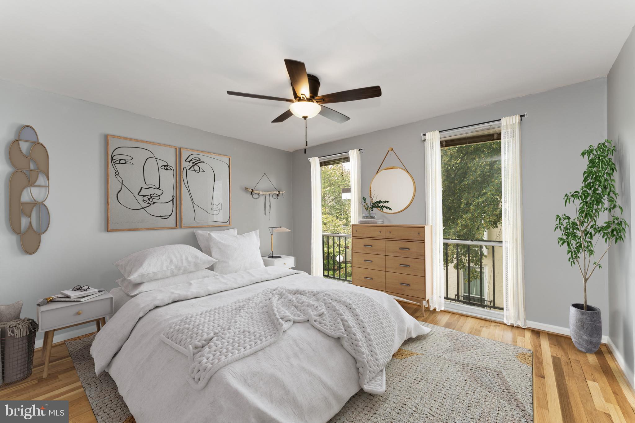 212 G Street Southwest, Unit 212 Washington, DC 20024 - Photo 13 of 17 a bedroom with a large bed and a window