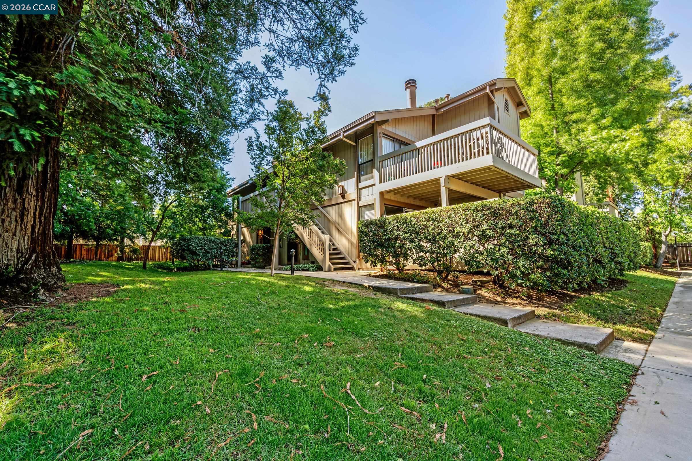 1544 Bailey Road, Unit 30 Concord, CA 94521 - Photo 2 of 33 a view of a house with a yard