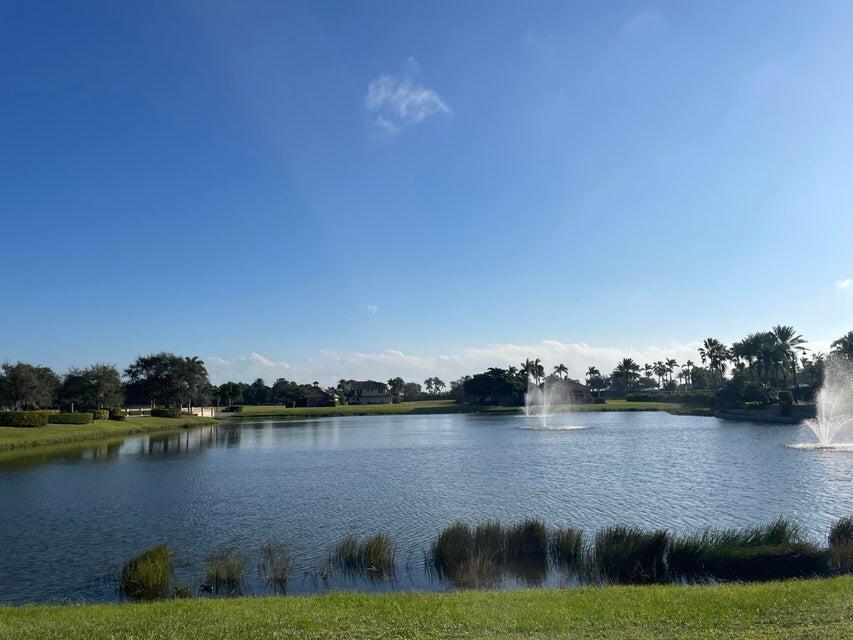 109 Southeast Rio Palermo Port St. Lucie, FL 34984 - Photo 1 of 8 a view of a lake with houses in the background