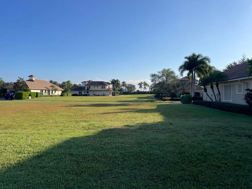 109 Southeast Rio Palermo Port St. Lucie, FL 34984 - Photo 3 of 8 a view of a swimming pool with an outdoor space and seating area