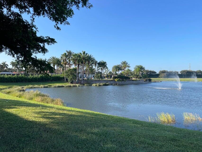 109 Southeast Rio Palermo Port St. Lucie, FL 34984 - Photo 5 of 8 a view of a lake with houses in the back