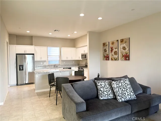 a kitchen with stainless steel appliances granite countertop a sink and cabinets