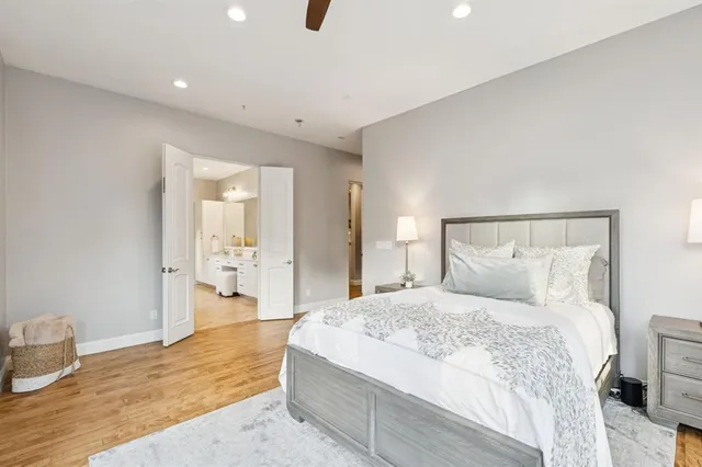 a bed room with a bed and a large window