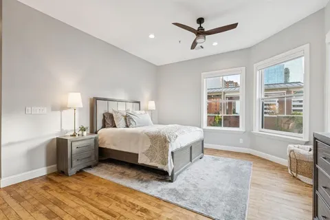 a large bathroom with a double vanity sink a mirror and shower