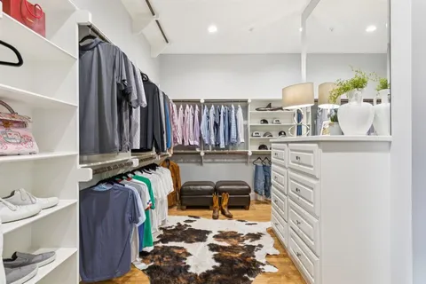 a bedroom with double bed and a large window