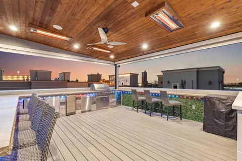 a bedroom with furniture and a large window