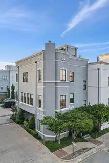 a front view of a building with garden