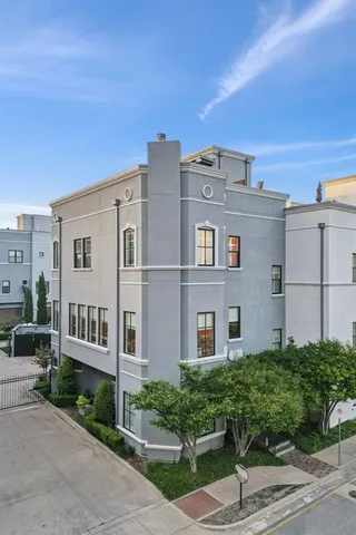 a front view of a building with garden