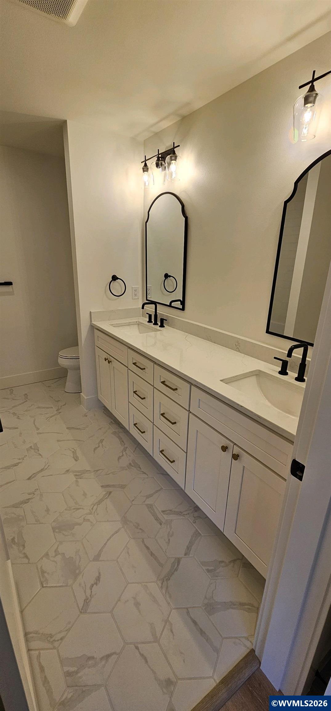 Model B Salishan Street Southeast Salem, OR 97302 - Photo 20 of 30 a bathroom with a double vanity sink and mirror