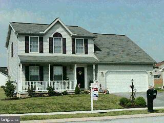 56 Apache Pass Hanover, PA 17331 - Photo 1 of 1 a view of a brick house with yard and plants
