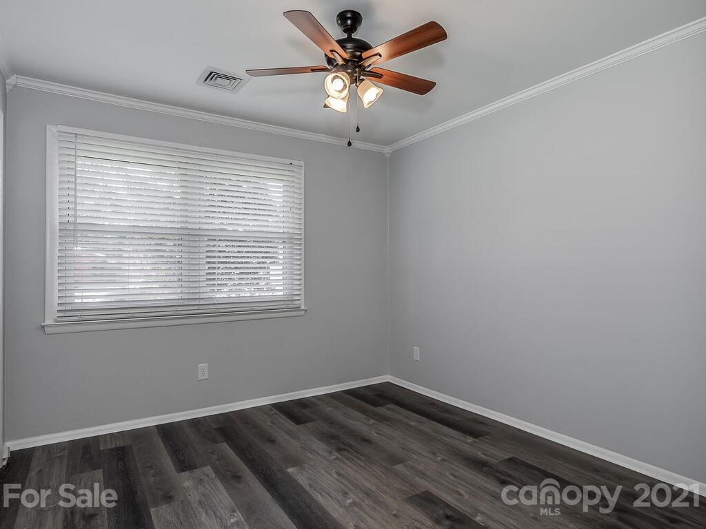 5223 Seacroft Road Charlotte, NC 28210 - Photo 17 of 23 a view of a room with a window and wooden floor